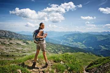 Wall Mural - female hiker giving thumbs up on trail summit