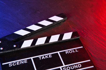 Wall Mural - Cinema clapboard on black stone