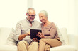 © Syda Productions - happy senior couple with tablet pc at home