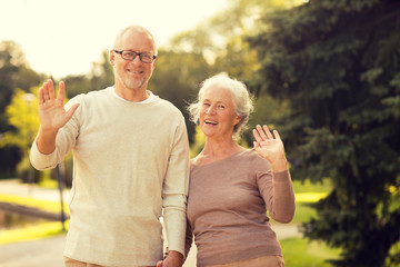 Wall Mural - senior couple hugging in city park