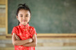 © PathomP - Little girl on red Chinese dress