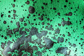 Canvas Print - Black stains on green texture.