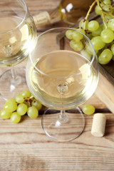 Still life of wine and bread on light background