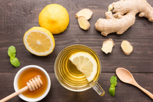 Cup Of Ginger Tea With Lemon And Honey On Wooden Background