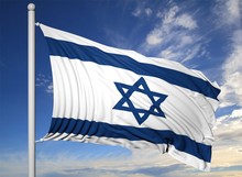 Waving Flag Of Israel On Flagpole, On Blue Sky Background.
