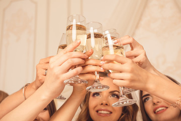 Wall Mural - Cheers! girls celebrate a bachelorette party of bride.