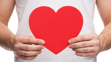 Wall Mural - closeup of man hands with heart