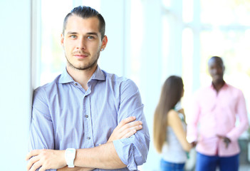 Canvas Print - Image of smart young businessmen looking at camera at meeting