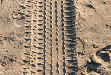 Trace Of Tire In The Sand