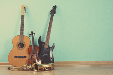 Poster - Musical instruments on turquoise wallpaper background