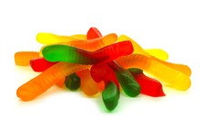 Pile Of Candy Gummy Worms Over A White Background
