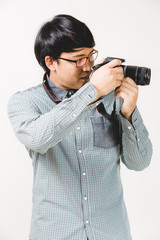 Young confident hipster man with beard posing on the white backg