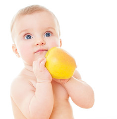Wall Mural - Beautiful baby with yellow apple. Baby eating healthy food isola