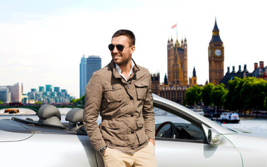 Wall Mural - happy man near cabriolet car over london city