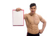 © Elnur - Muscular man with blank pad for your message
