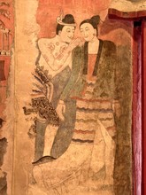 The Famous Mural Painting Of A Man Whispering To The Ear Of A Woman In Ancient Buddhist Temple - Wat Phumin, Nan Province, Thailand. The Temple Is Open To The Public.