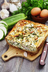 Pie with zucchini, sausage and herbs