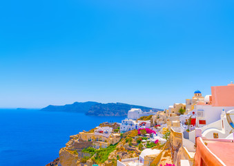 Wall Mural - View to the sea from Oia the most beautiful village of Santorini island in Greece