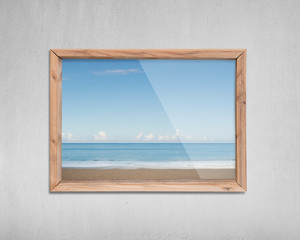 Wooden frame window with view of sky sea beach