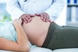 © WavebreakmediaMicro - Doctor examining pregnant woman in clinic