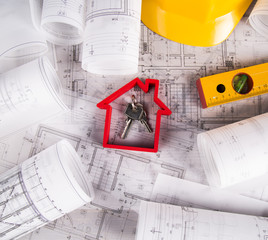 Architectural project and Yellow helmet and house model