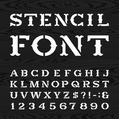 Poster - Western style retro alphabet vector stencil font. Serif type dirty letters, numbers and symbols on the dark wood textured background. Vintage vector typography for labels, headlines, posters etc.