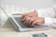 © jannoon028 - Closeup of business woman hand typing on laptop keyboard
