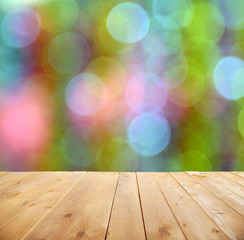 Wall Mural - Wooden table  with abstract  blur background