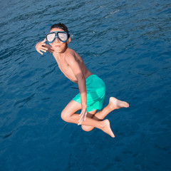 kid diving into the sea