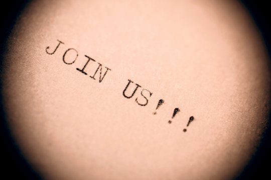 old typewriter with text join us
