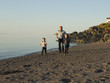 © Louis-Paul Photo - Father and children playing on the beach