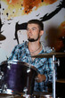 © Africa Studio - Excited drummer on bright background