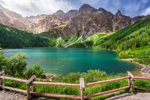 Obraz w ramie Crystal clear pond in the middle of the mountains