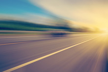 Abstract Empty Asphalt Blurry Road And Sunlight With Space