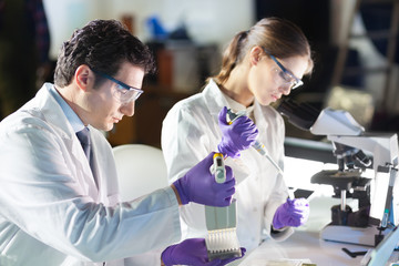 Poster - Life scientist researching in the laboratory.