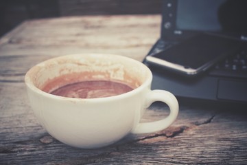 Canvas Print - Hot chocolate and computer notebook with smart phone on office table