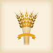 Golden sheaf of wheat with ribbon