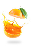 Fototapeta  - Orange juice splashing isolated on white