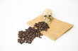 Coffee beans on a sack with skull on a white background