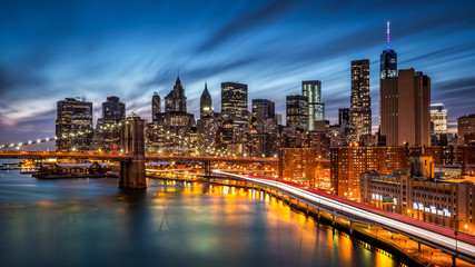 Fototapete - Brooklyn Bridge and the Lower Manhattan at dusk