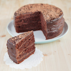 Wall Mural - Chocolate sponge cake with chocolate buttercream frosting and ganache