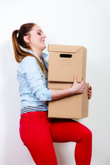 Wall Mural - Woman moving into apartment house carrying boxes.