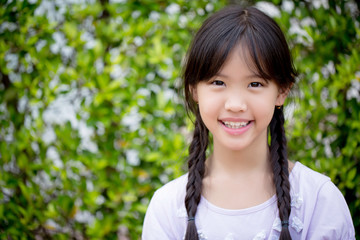 Portrait of beautiful Asian girl smiling in the garden