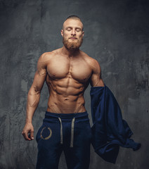 Wall Mural - Handsome muscular man with beard.