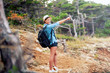© aboutmomentsimages - female with backpack trekking on mountains, walking through forest and hills. Happy woman, ready for adventure exploring the nature