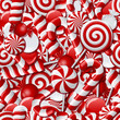 Seamless background with red and white candies. 