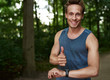 © Flamingo Images - Fit Guy Showing Thumbs up at the Park