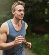 © Flamingo Images - Handsome Muscular Man Jogging at the Park