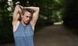 © Flamingo Images - Athletic Man Stretching Arms Behind his Head