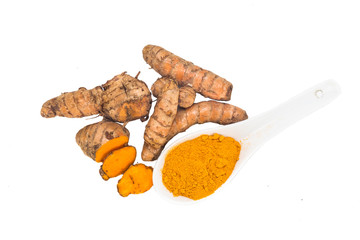 Turmeric roots and powder, healthy food with healing properties.